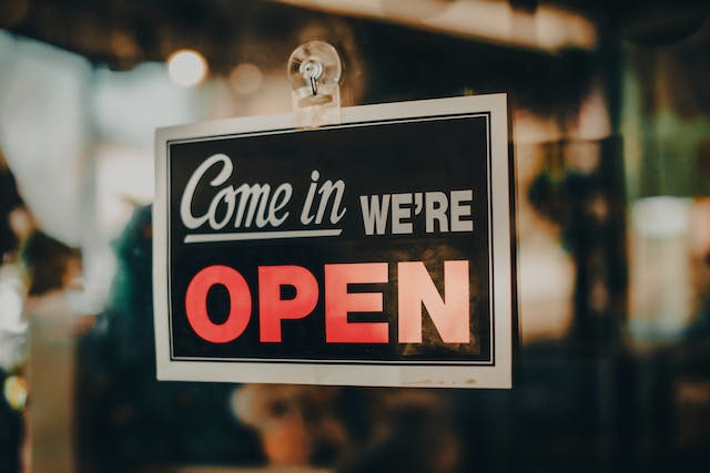 A sign that says "come in we're open."