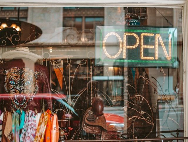 A store with a neon "open" sign.