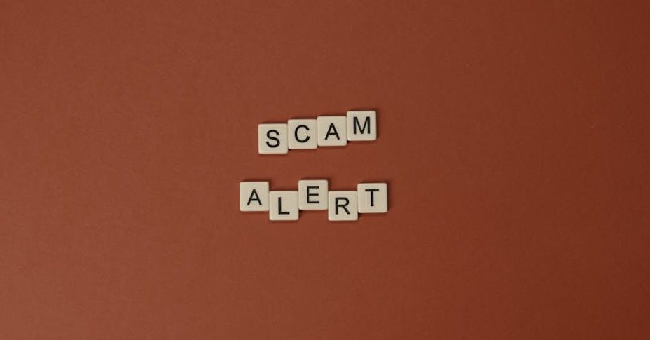 Wooden blocks that spell 'scam alert.'